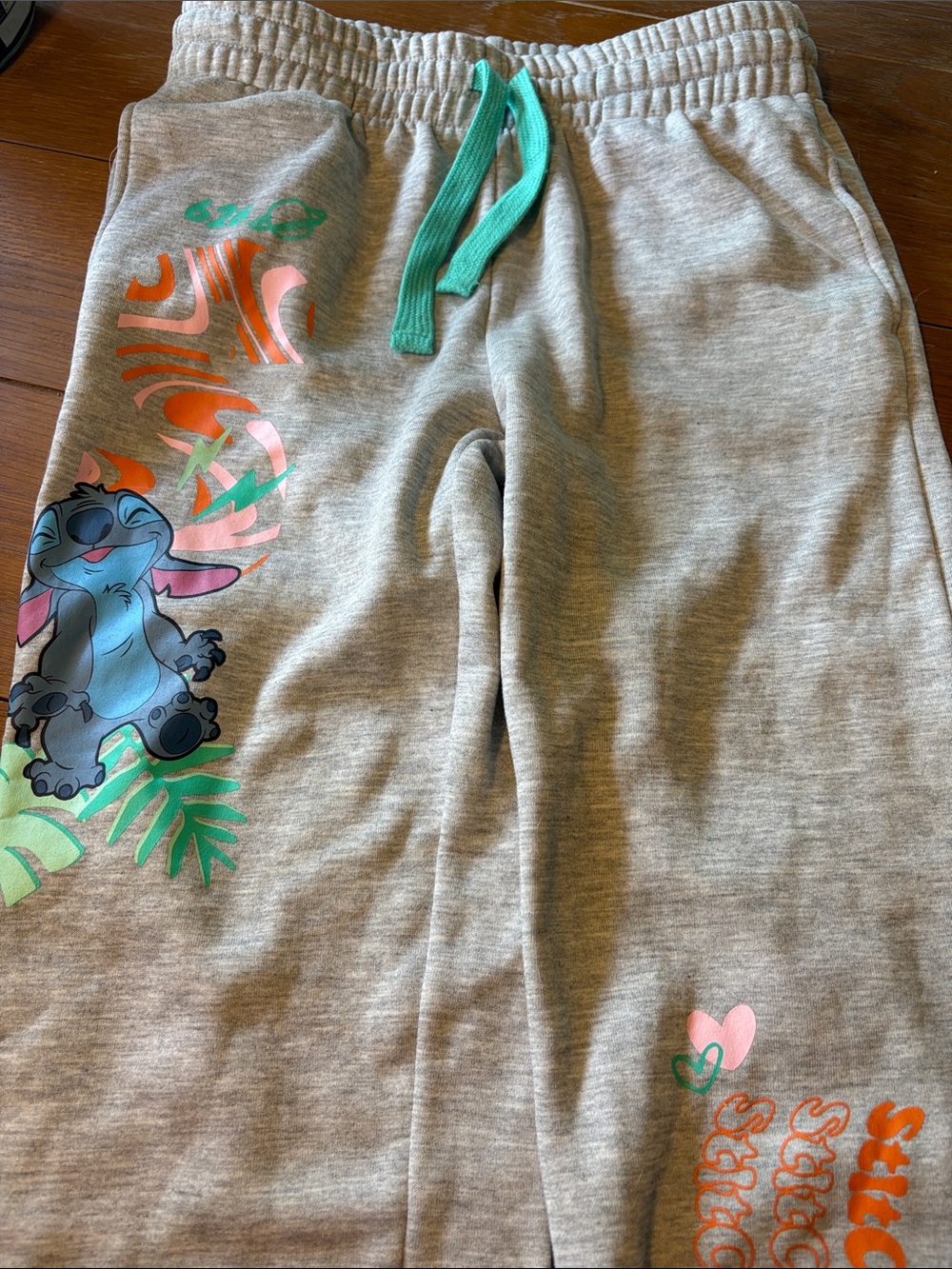 Disney Gray Sweatpants with Aqua Drawstring and Multicolor Stitch Graphic
